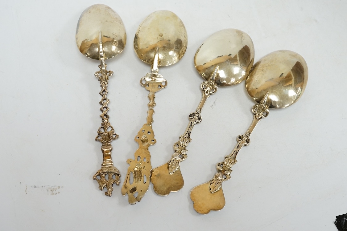 Four 19th century Dutch gilt white metal spoons, including a pair with import marks for Louis Landsberg, London, 1890, 83mm, 7.2oz.
